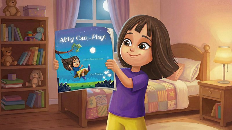 A young girl in a purple shirt and yellow pants stands in a cozy, moonlit bedroom. She is holding up a children's book titled "Abby Can...Play! A story about inclusion," which features a cover illustration of a girl on a swing.